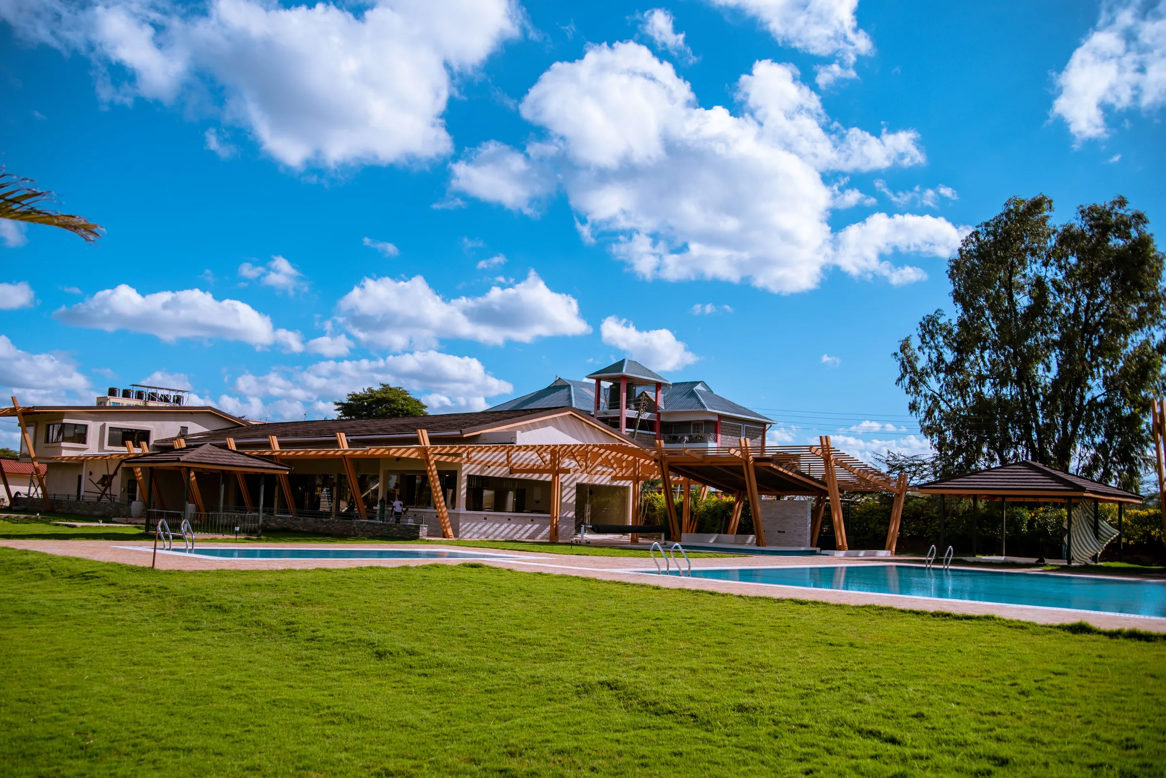 Lawn and pool deck at Acacia Woods Spa Resort